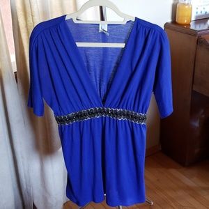 Jewel tone, waist detailed tunic.